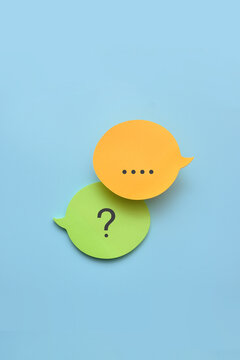 Question and message speech bubbles on blue background