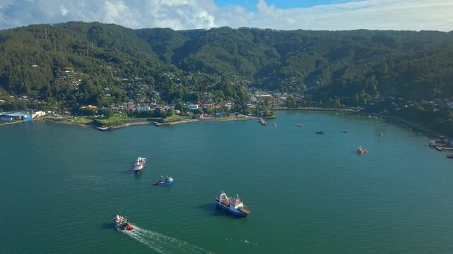 Aerial Dolly In Corral Bay with Cargo Ships and Coastal Landscape in Valdivia Chile