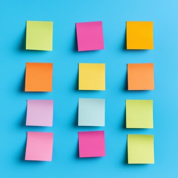 12 colorful blank sticky notes in a 3x4 grid on a bright blue wall, a vibrant display for ideas, tasks and organization. Modern, clean layout. reminders, brainstorming
