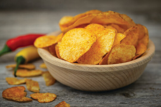 Spicy potato chips with peppers in the bowl	