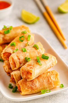 Fried spring rolls served with lime and sauce