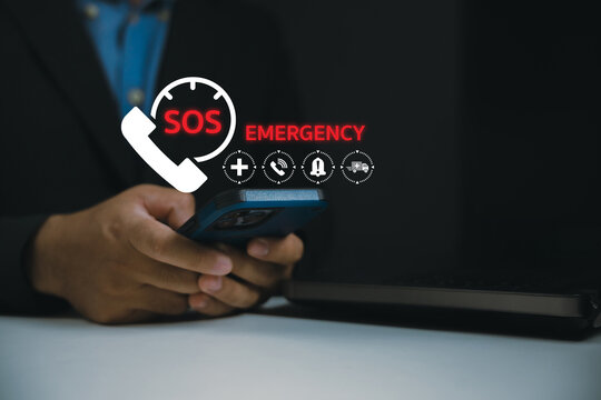A person holding a smartphone with digital SOS emergency icons displayed above, indicating urgent communication or help request.
