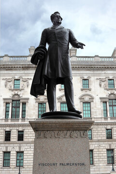 A life-size bronze statue of Henry John Temple, 3rd Viscount Palmerston by Thomas Woolner on the north side of Parliament Square in London, United Kingdom