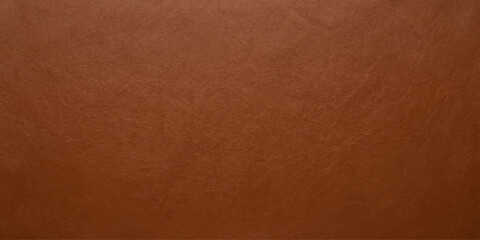 Fototapeta premium Close-up texture of rich brown leather, showing a natural grain pattern and subtle imperfections, conveying a sense of luxury and durability.