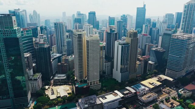 Dense financial district rises through tropical haze, Metro Manila skyline