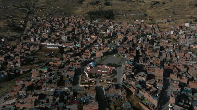 Aerial view of Puno and the waters of Lake Titicaca, showcasing one of Peru&rsquo;s most iconic high-altitude urban landscapes.