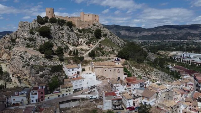 Orbiting around the Hermitage of the Blood and islamic castle of Castalla, Spain.