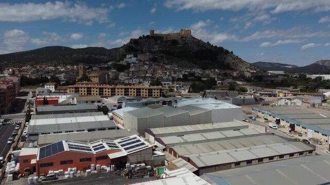 Flying over the Castalla industrial estate towards the Islamic castle. Spain.