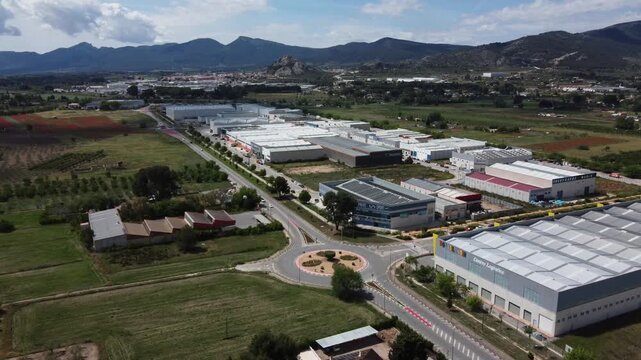 Flying towards the La Marjal Industrial Estate, with the town of Castalla in the background. Spain.