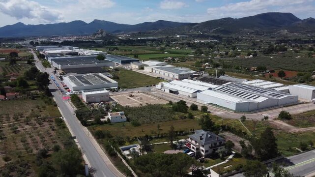 The La Marjal Industrial Estate in Onil, Spain, with the town of Castalla and its castle in the background.