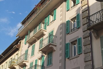 Obraz premium Elegant European Apartment Building with Green Shutters