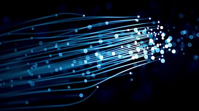 Luminous fiber optic cables transmitting streams of glowing digital data across a dark background, representing telecommunication, internet broadband speed, and modern network technology