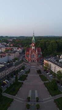 An aerial flyover of St. Joseph's Cathedral in Krakow at dawn in the summer in Poland.