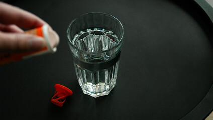 Hangover drinks, effervescent tablets, soluble drugs, sparkling vitamins. Glass of water, tube of...