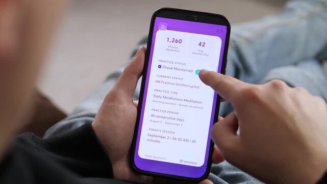 a user reviewing their mindfulness progress on a mobile device. The screen displays a 30 day streak, 1,260 minutes meditated, and a Streak Maintained status. Ideal for illustrating personal growth