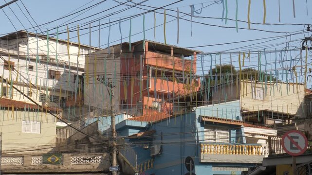 Green and yellow flags in a Brazilian neighborhood celebrating the 2026 World Cup.