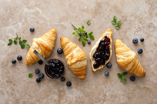 Croissant with blueberry jam for breakfast