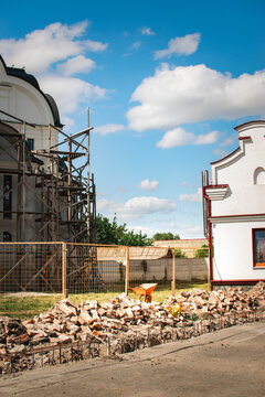 historic building restoration site with scaffolding and construction debris