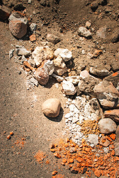 damaged asphalt road with concrete rubble and brick debris close up