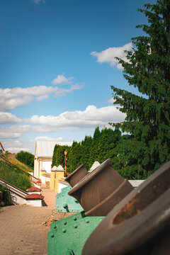 old artillery mortars displayed at historic site with fortress architecture
