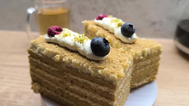 Honey-almond layered cake with berries on top	