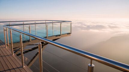 Fototapeta premium Modern glass observation deck over a cloudy canyon at sunrise, symbolizing visionary leadership and strategic business perspective.