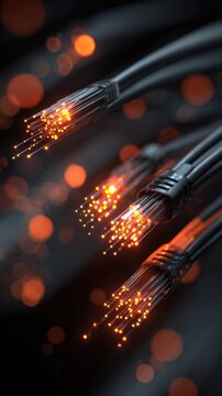 Fiber optic cables emitting glowing orange light signals representing high-speed data transmission in telecommunication networks with dark background and bokeh effec
