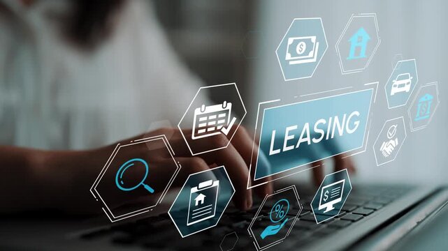 Hands Typing on Laptop with Leasing Icons and Graphics Representing Financial and Property Management Concepts in a Modern Office Environment. Entropy.