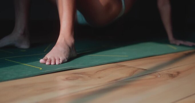 Athletic woman performing reverse tabletop hip raises during a home workout, strengthening the core, glutes, and upper body. Concept of functional fitness and body control.