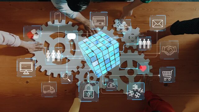Collaborative Business Strategy in Modern Workspace with Gears, Cube, and Digital Icons Representing Communication and Technology Solutions. Entropy.