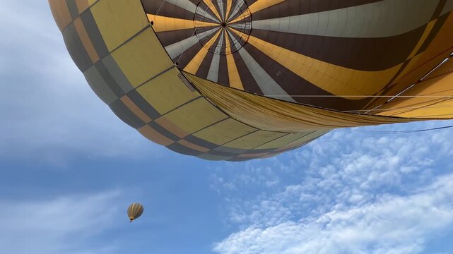 A hot air balloon few seconds before takeoff in Serengeti National Park, Tanzania.