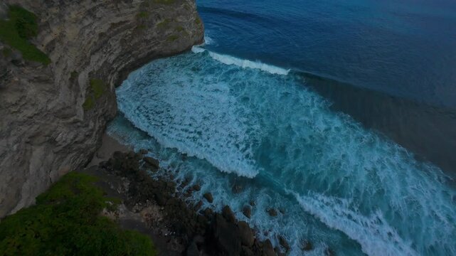 Extreme FPV Drone Dive Down Mercusuar Lighthouse Cliffs Above Powerful Ocean Waves And Rugged Tropical Coastline, Adrenaline Freedom Speed And Aerial Exploration in Bali