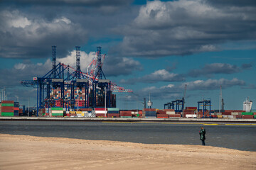  Industrial container terminal in sea port with cranes and cargo
