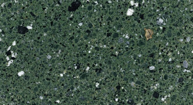 Deep green granite stone texture with black white and gold mineral flecks for background.