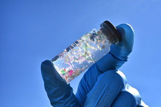 Collecting water samples containing microplastics, testing for plastic contamination