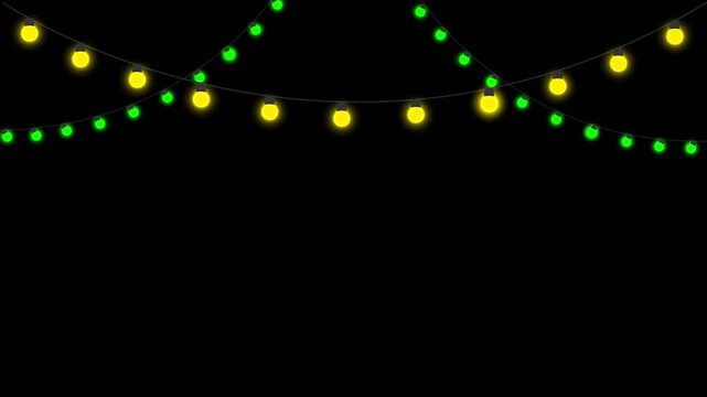 Festive string lights glowing yellow and green against a dark background video