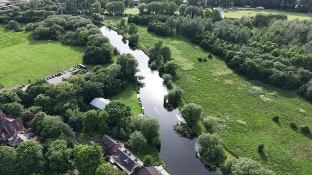 Aerial drone 4K scene showing a town district positioned near a countryside ridge with bright natural light Burton on Trent