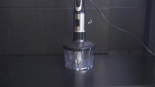 Kitchen blender with vegetable chopping attachment working. Uncompressed 24 bit high quality sound. Cooking technology and modern kitchen routine concept.