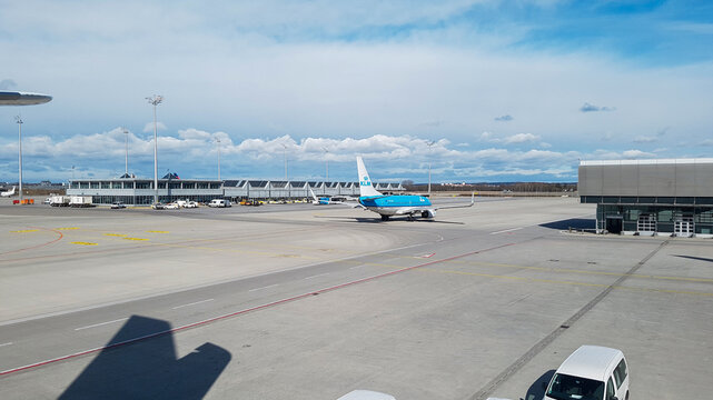 Munich, Germany - March 13, 2018 - KLM Airplane Taxiing on the Wet Tarmac at Munich Airport