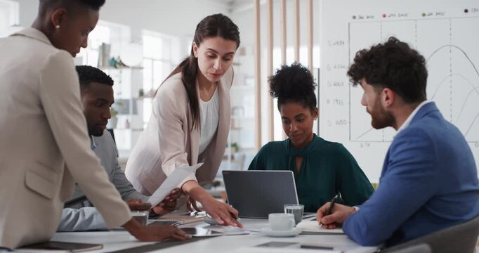 Business people, discussion and documents with collaboration in boardroom, planning or strategy. Team leader, group and meeting with proposal file, pitch prep or paperwork with agenda in workplace