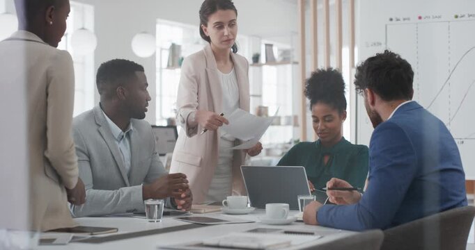 Business, meeting and woman giving paperwork for collaboration in boardroom, planning or strategy. Team leader, people and discussion with proposal, pitch prep or documents with agenda in workplace