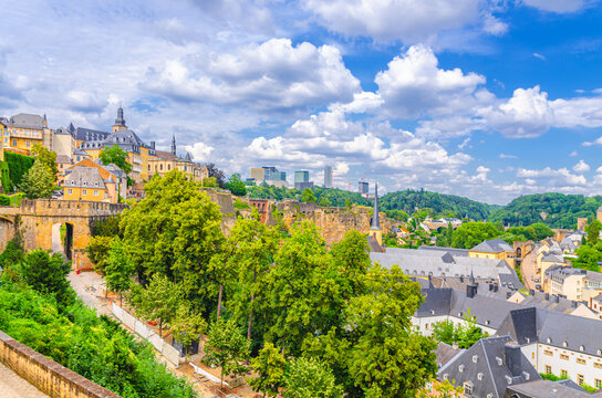 Luxembourg City historical centre panoramic view, old colorful buildings and green trees, Luxembourg cityscape skyline with blue sky, panorama of Luxembourg old town Grund and Ville Haute districts