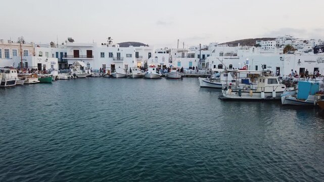 Naoussa typical waterfront view with sunshine, small village on Paros island, Greece
