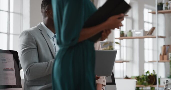 Company, business people or team discussion with laptop for financial proposal or asset management. Computer, glass office or collaboration with employees, investment evaluation or dividend yield