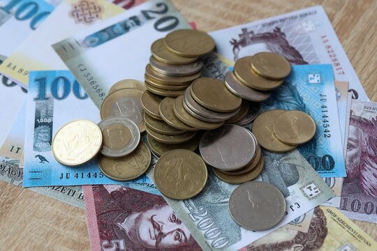 Hungarian forint money bills and coins on table. Hungary cash of HUF currency close up