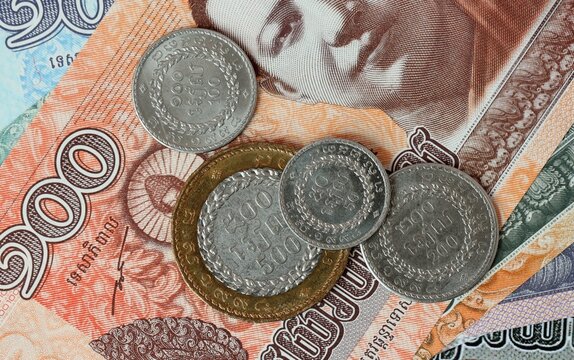 Cambodian riel money bills and coins on table. Cambodia cash of KHR currency
