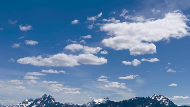 Majestic Snow-Capped Mountains Underneath a Dynamic Time Lapse of Clouds in Fraser Valley, British Columbia