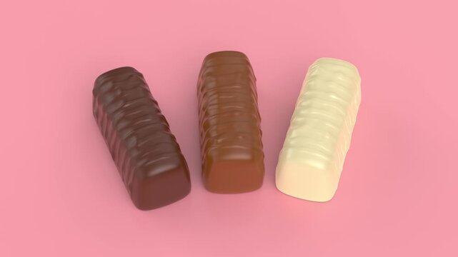 Dark, milk and white chocolate pralines on shiny pink background