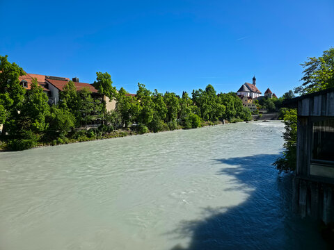 germany, radiant fuessen riverside panorama with charming church colorful houses and lush trees beneath brilliant summer sky