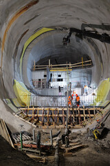 Fototapeta premium View of workers at the construction site of a subway tunnel under the city